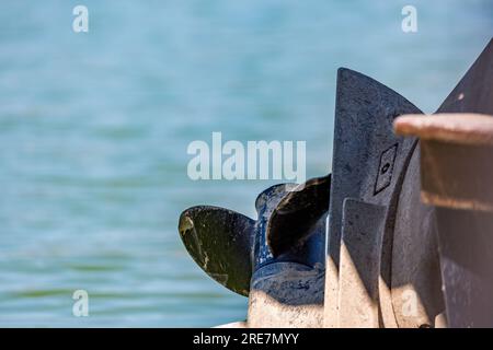 Boat propeller on blurred water blue background, lake Kerkini national natural reserve park, Northern Greece Stock Photo