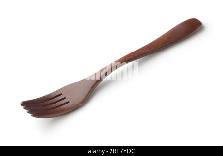Dark brown wooden fork isolated on white Stock Photo