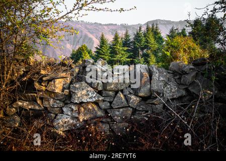 Breathtaking view of Uttarakhand's Himalayan region with stone walls ...
