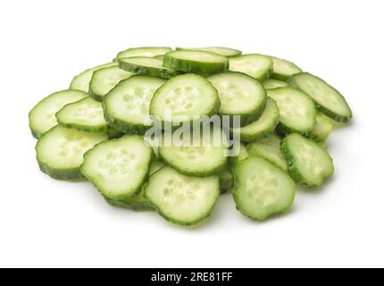Heap of fresh sliced cucumbers isolated on white Stock Photo