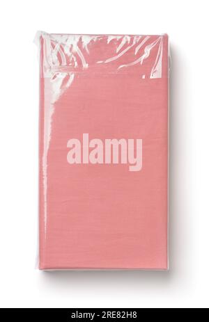 Top view of folded pink cotton bedding sheets in clear plastic bag isolated on white Stock Photo