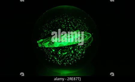 Laser engraved model of the Solar System, including Earth, inside a glass sphere. Solar System in Milky Way Galaxy on black background. Space, galaxie Stock Photo