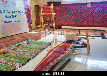 A display of a traditional weaving loom for bright, colorful textiles ...