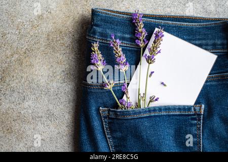 Classic blue jeans with lavender flowers Stock Photo