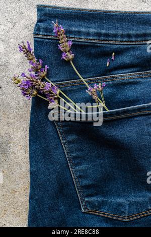 Classic blue jeans with lavender flowers Stock Photo