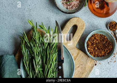 Spices set in ceramic bowls for cooking on concrete table Stock Photo