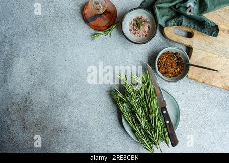 Spices set in ceramic bowls for cooking on concrete table Stock Photo