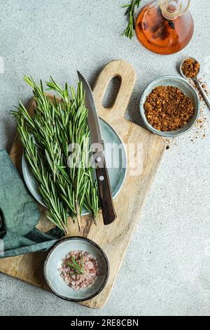 Spices set in ceramic bowls for cooking on concrete table Stock Photo