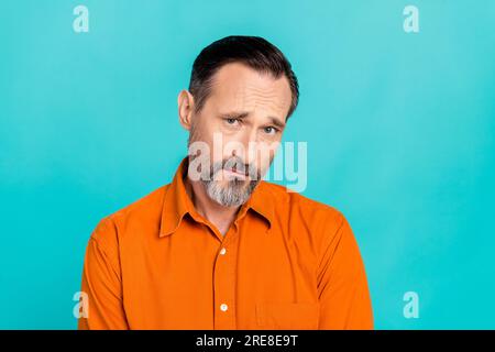 Photo of funny grimace dislike dissatisfied bad mood unhappy businessman problems stress offended isolated on aquamarine color background Stock Photo