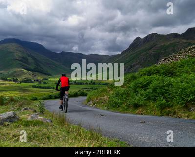 Cyclist in Langdale Fells, Lake District Stock Photo