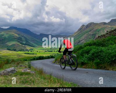 Cyclist in Langdale Fell, Cumbria Stock Photo