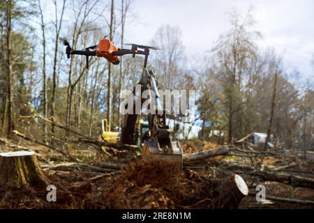 Monitoring uprooting trees at construction sites is being carried out by environmental services through use of drones. Stock Photo