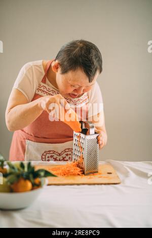 rub carrots and grater Stock Photo - Alamy