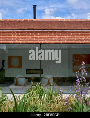 New courtyard with view to living quarters. Listed Farmstead, Suffolk, United Kingdom. Architect: Rodic Davidson Architects, 2021. Stock Photo