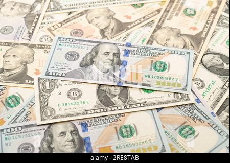 Image of wealth and prosperity with banknotes of 1, 10, 50 and 100 dollars scattered. Stock Photo