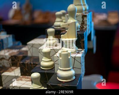 The unique shape of a chess horse made of wood. Selected focus. Stock Photo