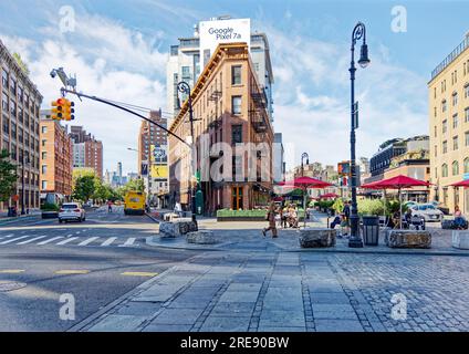 The Herring Building, at the intersection of NYC’s Hudson Street, Ninth Avenue and West 13th Street, is a factory repurposed to offices and retail. Stock Photo