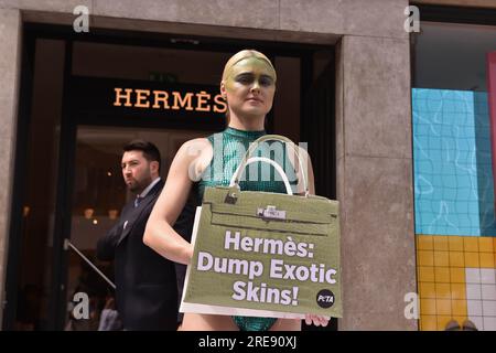 London, England, UK. 26th July, 2023. Vegan activist TASH PETERSON and PETA  staged a protest outside the Hermes store on Bond Street, calling on the  luxury brand to end the use of