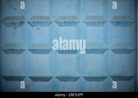Checkered wall. Concrete fence. Blue background. Three-dimensional image. Stock Photo