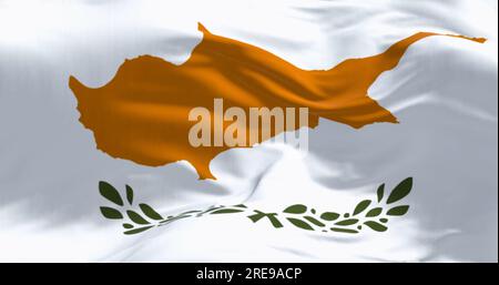 Close-up of Cyprus national flag waving in the wind on a clear day. White with a copper-orange island silhouette and two green olive branches below it Stock Photo