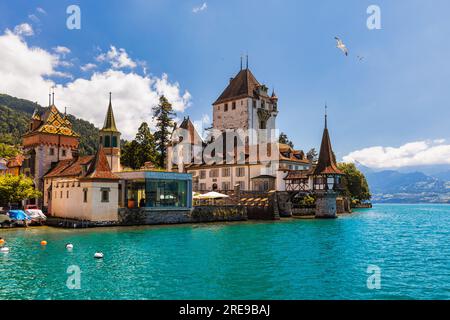 Oberhofen Castle at Lake Thunersee in swiss Alps, Switzerland. Schloss Oberhofen on the Lake Thun (Thunersee) in Bern Canton of Switzerland. Oberhofen Stock Photo