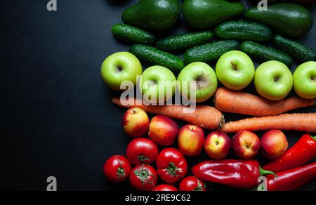 Fresh seasonal fruit and vegetables on dark background. Healthy food template Stock Photo