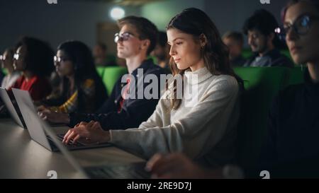 Smart Young Students Studying in University with Diverse Multiethnic Classmates. Scholars Have a Conversation in College Room. Applying Knowledge Stock Photo