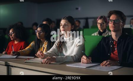 Smart Young Students Studying in University with Diverse Multiethnic Classmates. Scholars Have a Conversation in College Room. Applying Knowledge Stock Photo