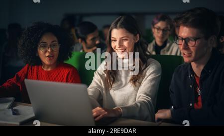 Smart Young Students Studying in University with Diverse Multiethnic Classmates. Scholars Have a Conversation in College Room. Applying Knowledge Stock Photo