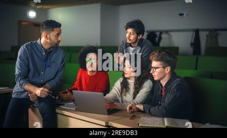 Smart Young Students Studying in University with Diverse Multiethnic Classmates. Scholars Have a Conversation in College Room. Applying Knowledge Stock Photo