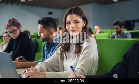 Close Up Portrait of a Creative Student in Lecture. Young Person Studying in University with Diverse Multiethnic Classmates, , Attending Conference Stock Photo