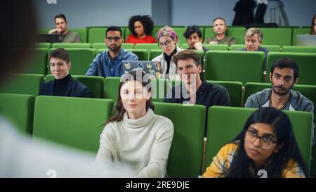 Smart Young Students Studying in University with Diverse Multiethnic Classmates. Scholars Have a Conversation in College Room. Applying Knowledge Stock Photo