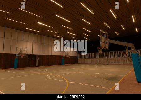 A basketball court at night Stock Photo