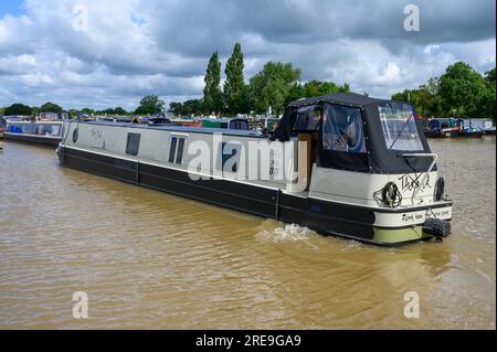 New narrowboat called The Mole on its moorings in a marina. The boat is  named after the book The Boy, the Mole, the Fox and the Horse by Charlie  Macke Stock Photo 