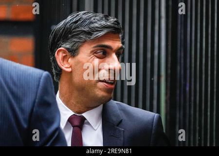 London, UK. 26th July, 2023. Prime Minister Rishi Sunak exits following his appearance at the Infected Blood Inquiry today, held near Aldwych in central London. The inquiry is ongoing.The PM is said to face pressure from bereaved families accept compensation recommendations by the inquiry's chairman, which were made three months ago. Sunak arrived and left via the Civil Service Club, connected to the back of the building and venue, rather than the front entrance where he would have faced the press, as well as bereaved families and protesters. Credit: Imageplotter/Alamy Live News Stock Photo