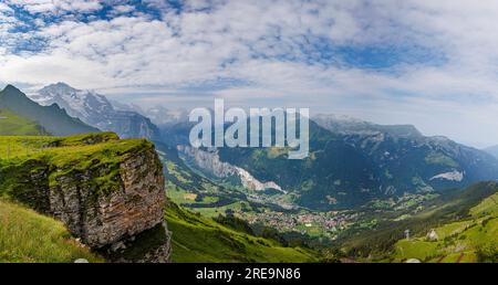 Panoramic snow covered range of mountain peaks view seen from Mannlichen above Wengen over the Lauterbrunnen Valley, Bernese Oberland, Switzerland Stock Photo