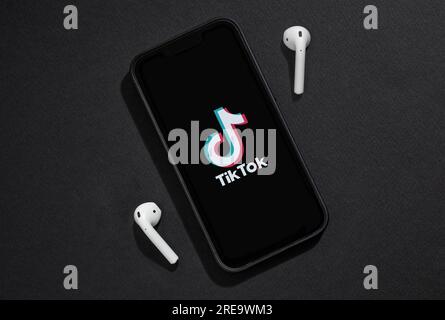 Antalya, Turkey - July 26, 2023: Tiktok logo on iPhone 13 Pro Smartphone screen with black background Stock Photo