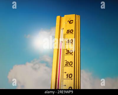 Hot summer day, the thermometer displays a high heatwave temperature of 43 degrees Celsius. Extreme weather, global climate change . Stock Photo