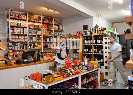Inside small supermarket (Mini Mercado) with shelves stocked with foods, Portugal Stock Photo