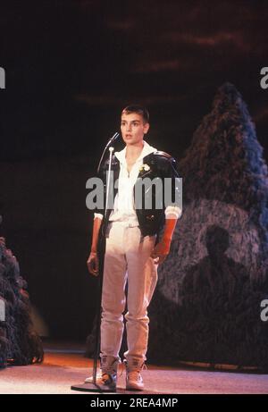 FILED - 16 March 1990, North Rhine-Westphalia, Cologne: The singer Sinead O'Connor ( Shuhada' Sadaqat ) at a TV appearance on 16.03.1990 Photo: Horst Galuschka/dpa Stock Photo