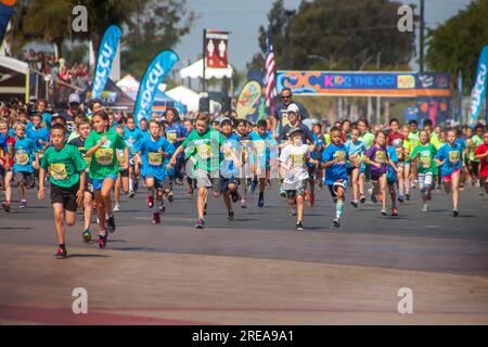 Costa Mesa, California, USA. 5th May, 2018. 10-year-old multiracial runners leave the starting line as the race begins at a community track event in Costa Mesa, CA. (Credit Image: © Spencer Grant/ZUMA Press Wire) EDITORIAL USAGE ONLY! Not for Commercial USAGE! Stock Photo