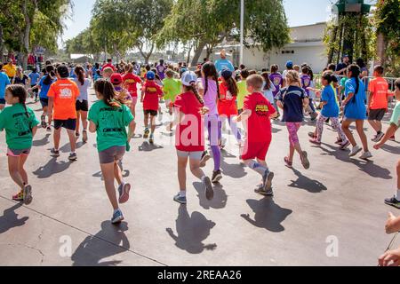 Costa Mesa, California, USA. 5th May, 2018. 10-year-old multiracial runners leave the starting line as the race begins at a community track event in Costa Mesa, CA. (Credit Image: © Spencer Grant/ZUMA Press Wire) EDITORIAL USAGE ONLY! Not for Commercial USAGE! Stock Photo