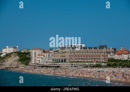 Biarritz beach full of people bathing and sunbathing on a summer afternoon. Stock Photo