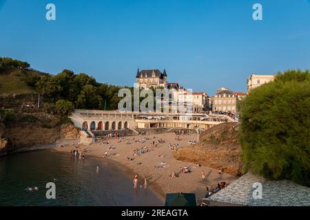 Biarritz beach 'Plage du Port Vieux' full of people bathing and sunbathing on a summer afternoon. Stock Photo