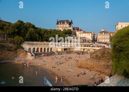 Biarritz beach 'Plage du Port Vieux' full of people bathing and sunbathing on a summer afternoon. Stock Photo