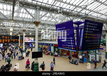 Bustling crowd of people inside Waverley train station, Edinburgh ...