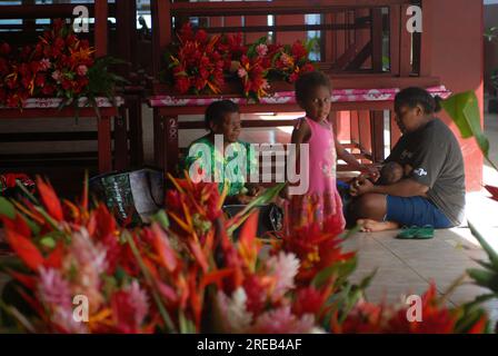 Mother and daughter at Port Vila flower market, Vanuatu. Stock Photo