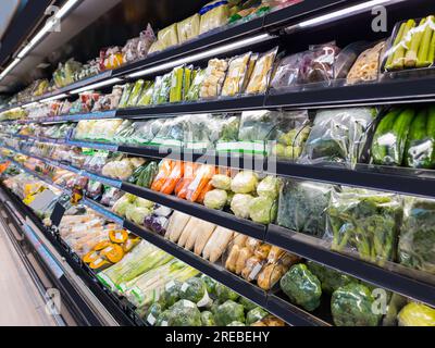 Various of vegetable products on shelf in modern supermarket. Stock Photo