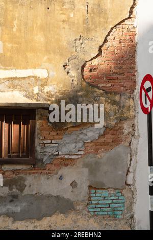 Georgetown grunge brick wall in Penang, Malaysia Stock Photo
