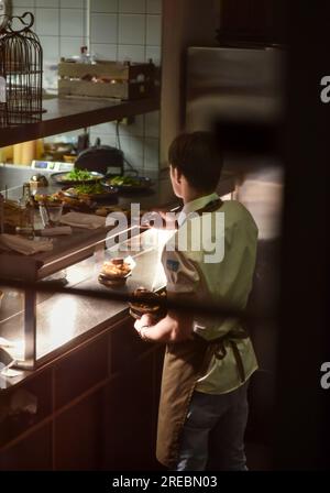 Rotterdam, Netherlands December 2 2022, Restaurant workers in kitchen Rotterdam Stock Photo